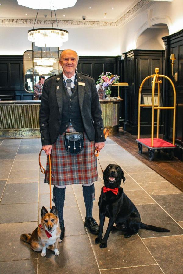 Cameron House On Loch Lomond Alexandria Exterior photo A Scottish hotel porter in traditional uniform